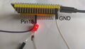 Blinking led. It is connected to pin18 and GND. Note that the (current limiting) resistor resistor is missing.